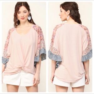 Floral Knit Print Ruffle Sleeve Top with Center Front Knot Detail. Pastel pink.
